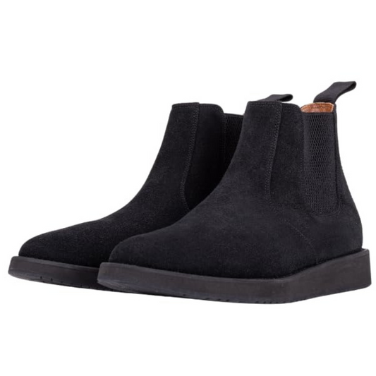 A pair of black leather Chelsea boots with a rubber sole.