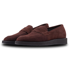 A pair of brown suede leather moccasin loafers for men.