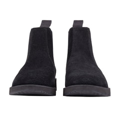 A pair of black leather Chelsea boots with a rubber sole.