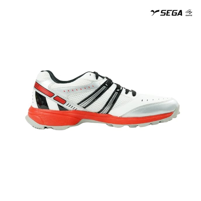 A pair of white cricket shoes with red accents and a distinctive design on the sole.