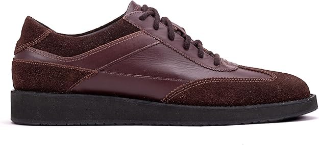 A pair of brown suede leather semi-formal trainers with a lace-up closure and a thick sole.