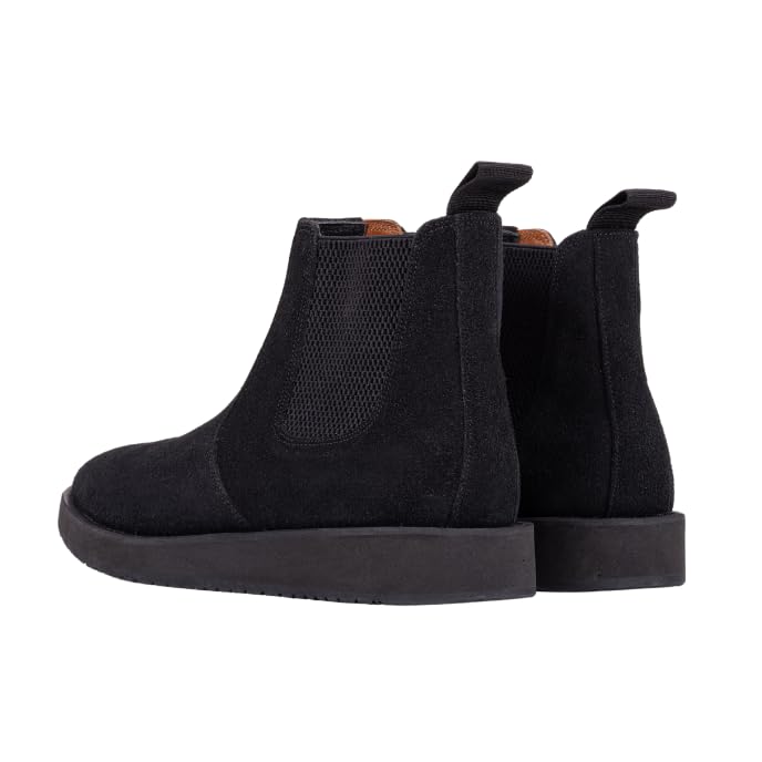 A pair of black leather Chelsea boots with a rubber sole.