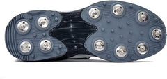 A pair of white, and grey cricket bowling shoes with metal spikes and an external strap for support.