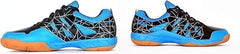 A pair of SEGA LOTUS badminton tennis and squash court shoes with a black and blue design and orange accents.