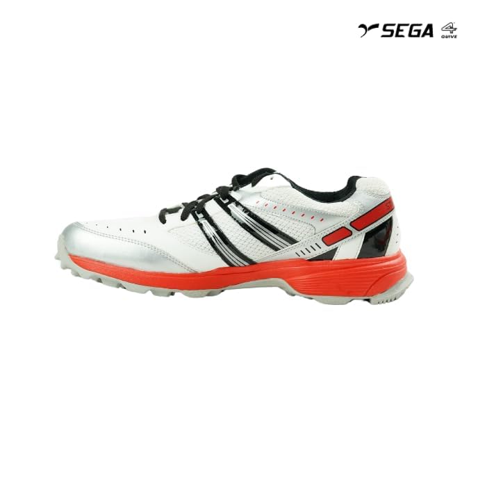 A pair of white cricket shoes with red accents and a distinctive design on the sole.