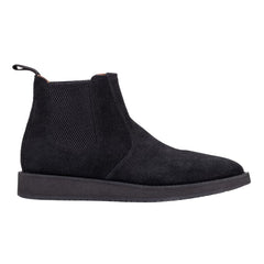 A pair of black leather Chelsea boots with a rubber sole.