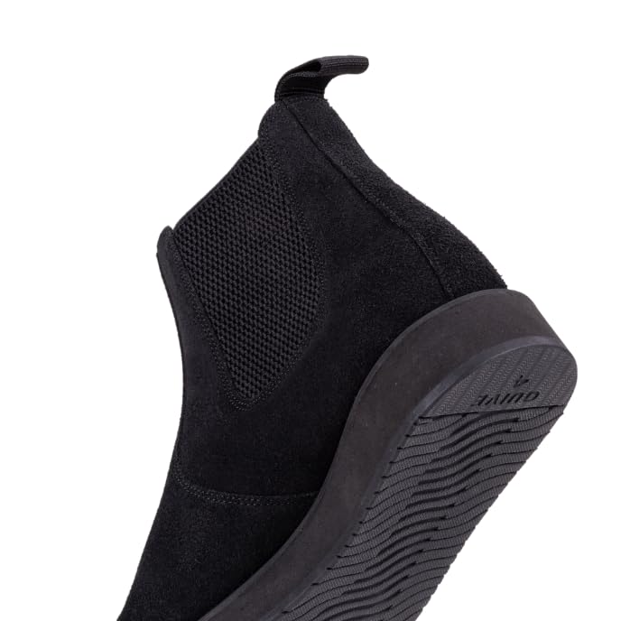 A pair of black leather Chelsea boots with a rubber sole.