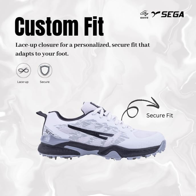 A pair of Sega Freedom men's cricket shoes featuring durable metal spikes and a white low-profile design with black accents.