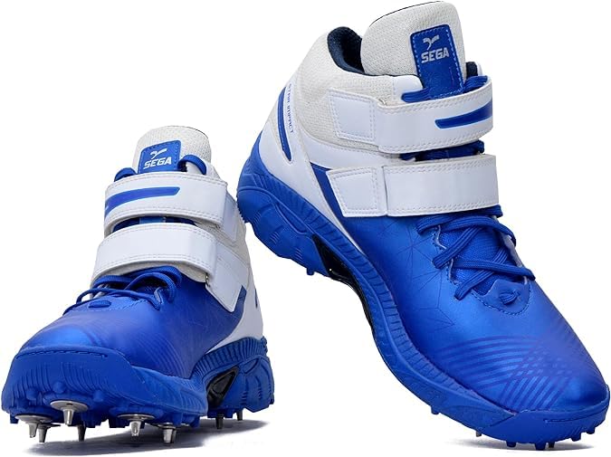 A pair of blue, and white cricket bowling shoes with metal spikes and an external strap for support.