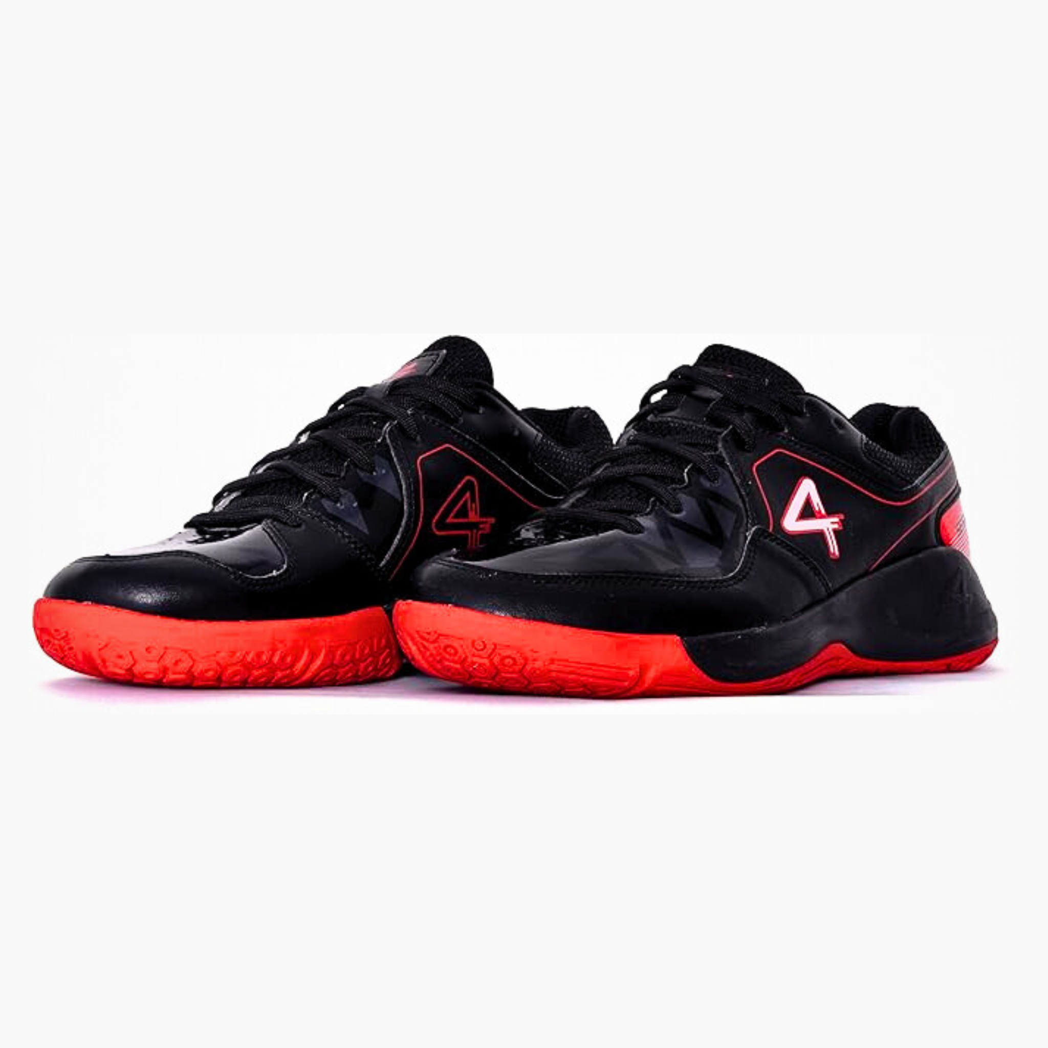 Black sports shoe with red accents on a white background, badminton, squash, tennis, table tennis