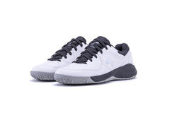 White sports shoe with black accents on a white background, badminton, squash, tennis, table tennis