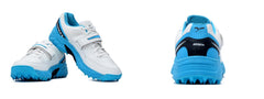 A pair of white, blue QUIVE SEGA REACH Performance Cricket Studs Boots with a synthetic and textile upper, featuring a midfoot band and a rubber outsole.