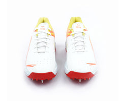 White, orange, and red cricket shoes sports cleats on a white background