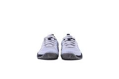 A pair of white QUIVE SEGA RP24 badminton squash court trainers with black accents and a textured sole.