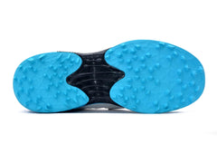 A pair of white, blue QUIVE SEGA REACH Performance Cricket Studs Boots with a synthetic and textile upper, featuring a midfoot band and a rubber outsole.