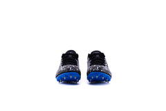 A pair of green and black Sega Aston AR 7 Metal Spikes athletic running spikes with metal spikes on the sole and a blue accent on the side.