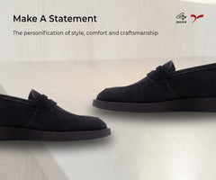 Pair of black loafers on a white background