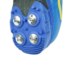 A pair of blue Sega P-25 cricket shoes with yellow accents and metal spikes on the sole.