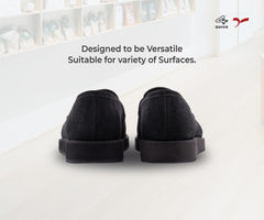 Pair of black loafers on a white background