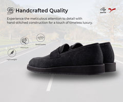 Pair of black loafers on a white background