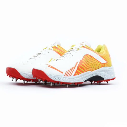 White, orange, and red cricket shoes sports cleats on a white background