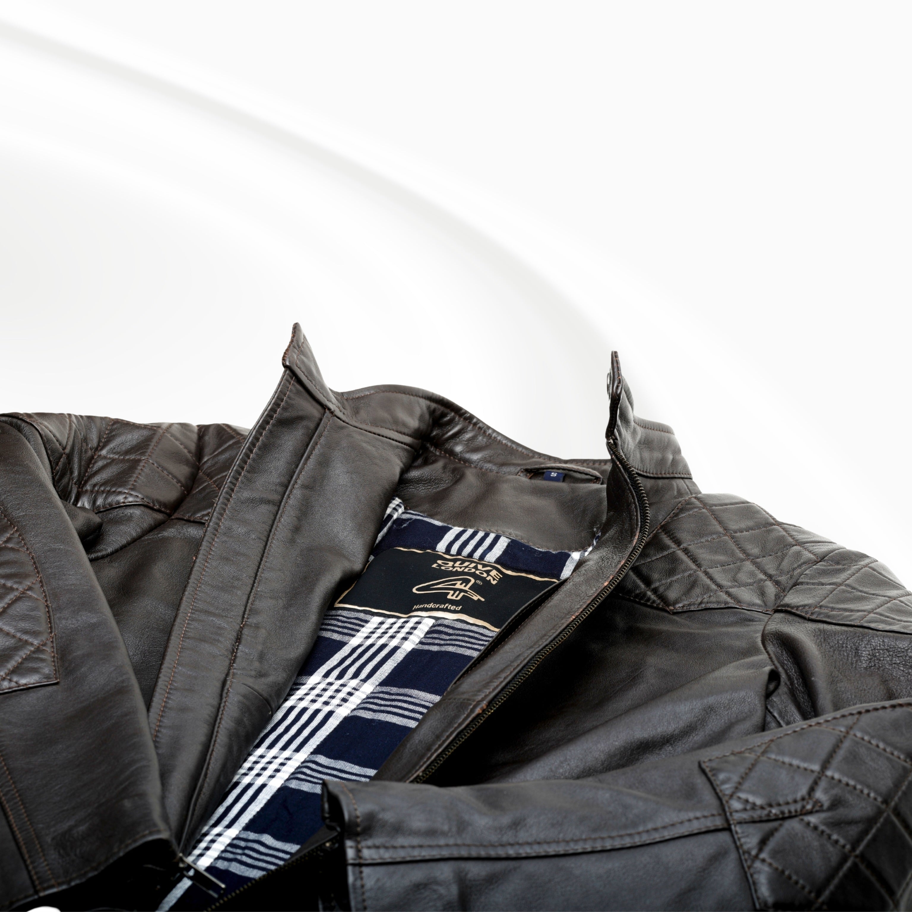 Brown leather jacket a white background
