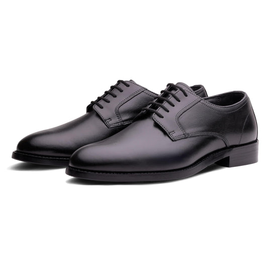 Pair of black work and dress shoes on a white background