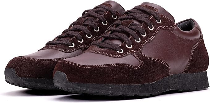A pair of brown semi-formal lace-up fashion shoes made of premium suede leather, with a rubber sole.