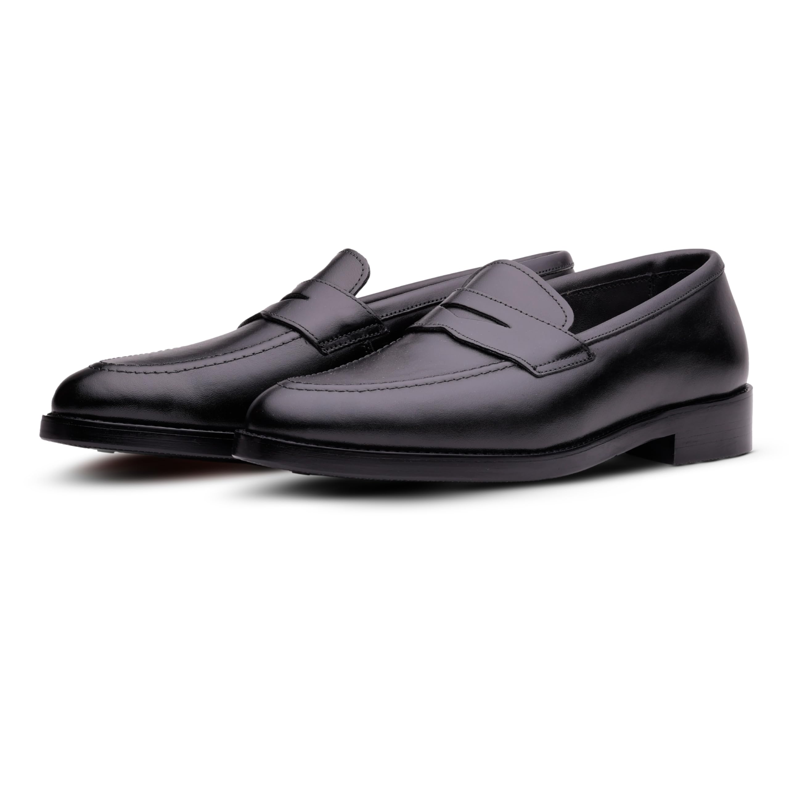 Pair of black loafers on a white background