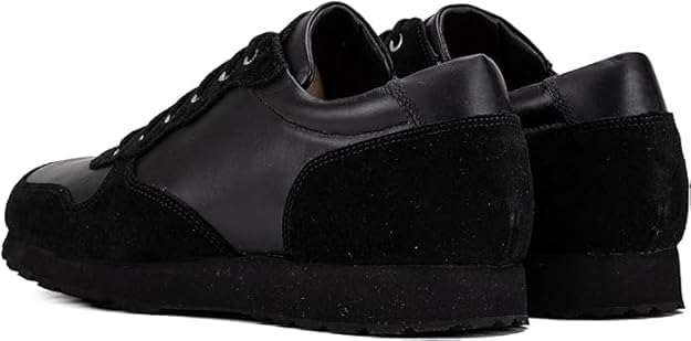 Black QUIVE London Belgravia leather trainers in a rear three-quarter view