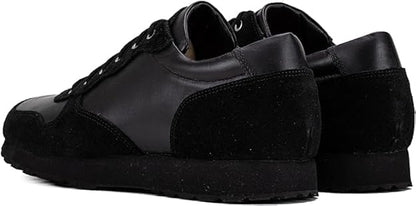 Black QUIVE London Belgravia leather trainers in a rear three-quarter view