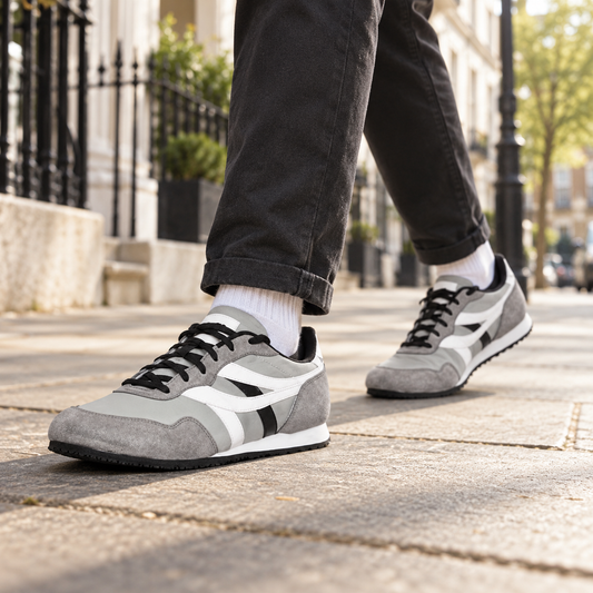 Grey SEGA men's suede leather trainers worn on a British city street