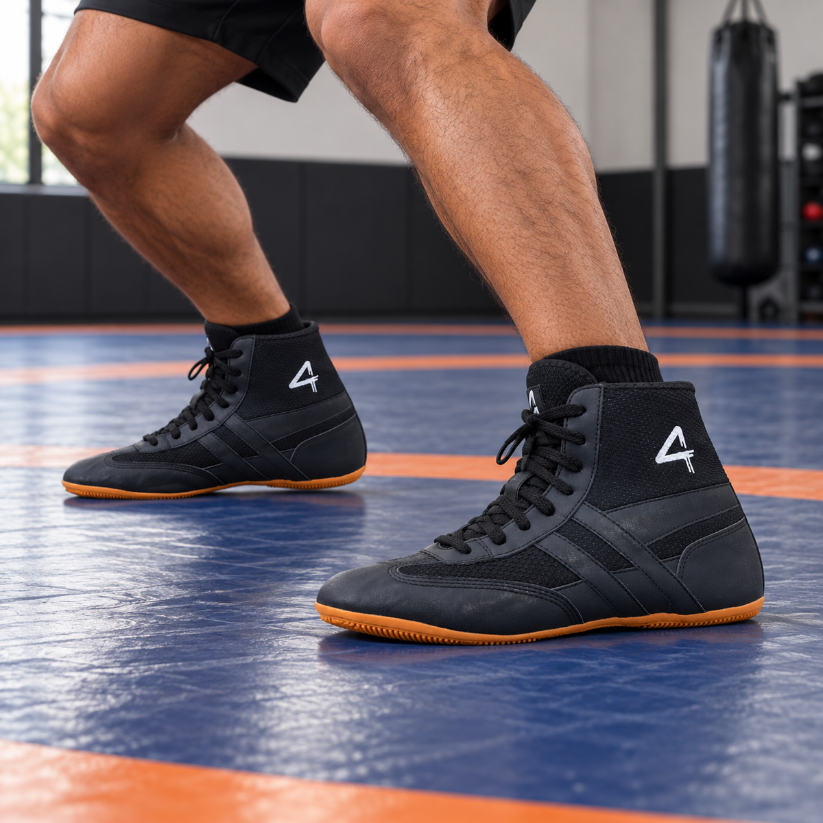 Black SEGA QUIVE Kabaddi high-top wrestling shoes worn during mat footwork