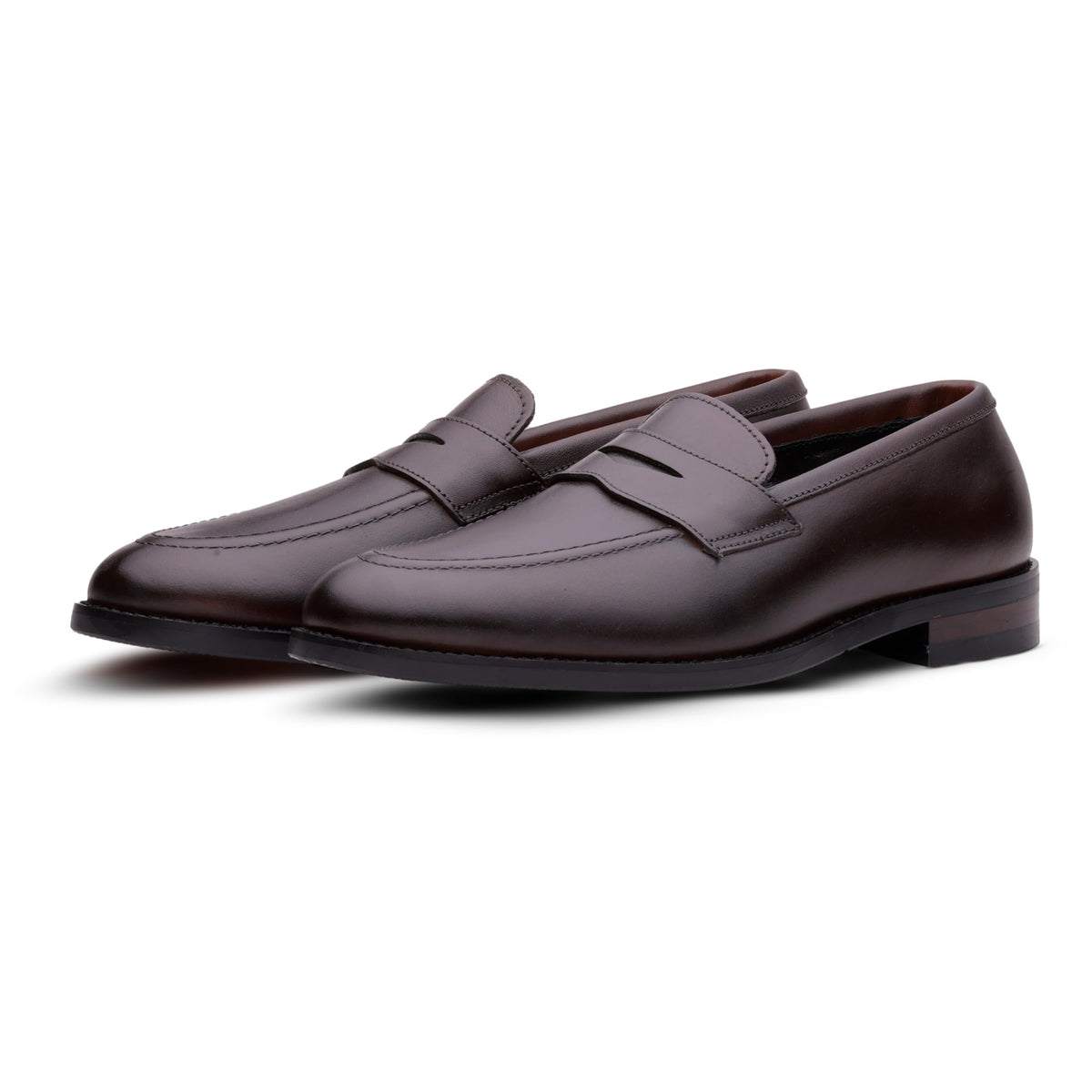Brown QUIVE London Ventor leather penny loafers in a front three-quarter view
