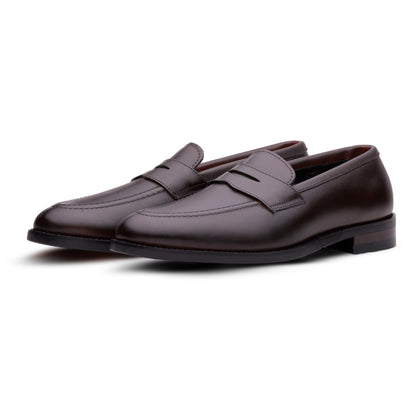 Brown QUIVE London Ventor leather penny loafers in a front three-quarter view
