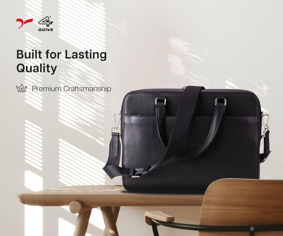 Black QUIVE London Cavendish leather laptop bag displayed on a desk