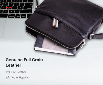 QUIVE London Portman leather crossbody bag open beside a laptop