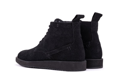 Black QUIVE London Chester suede chukka boots in a rear three-quarter view