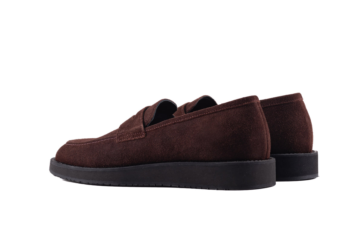 Brown QUIVE London Cambridge suede loafers in a rear three-quarter view