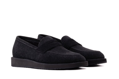 Black QUIVE London Cambridge suede loafers in a rear three-quarter view