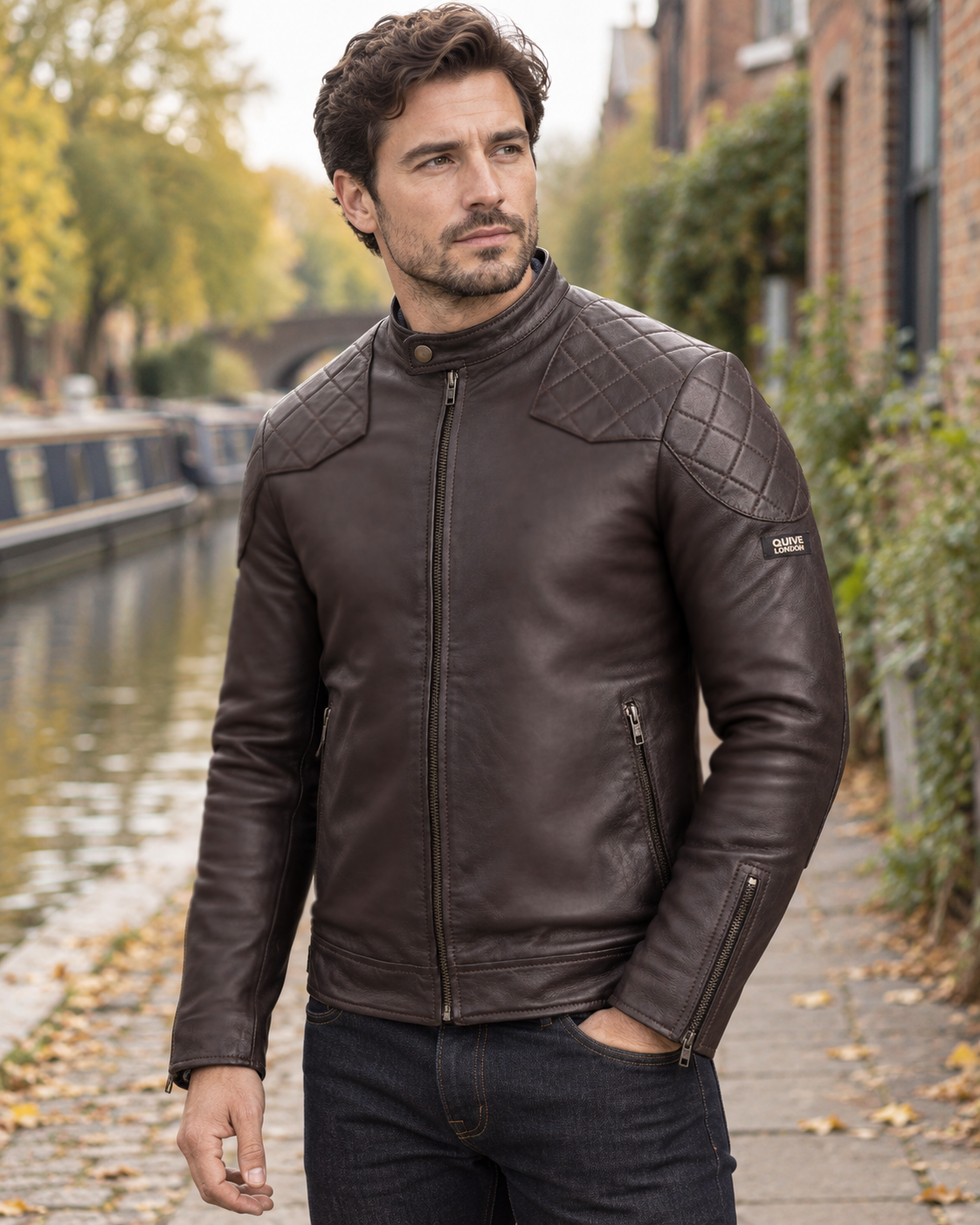 Man wearing the brown QUIVE London BROMPTON leather biker jacket by an English canal
