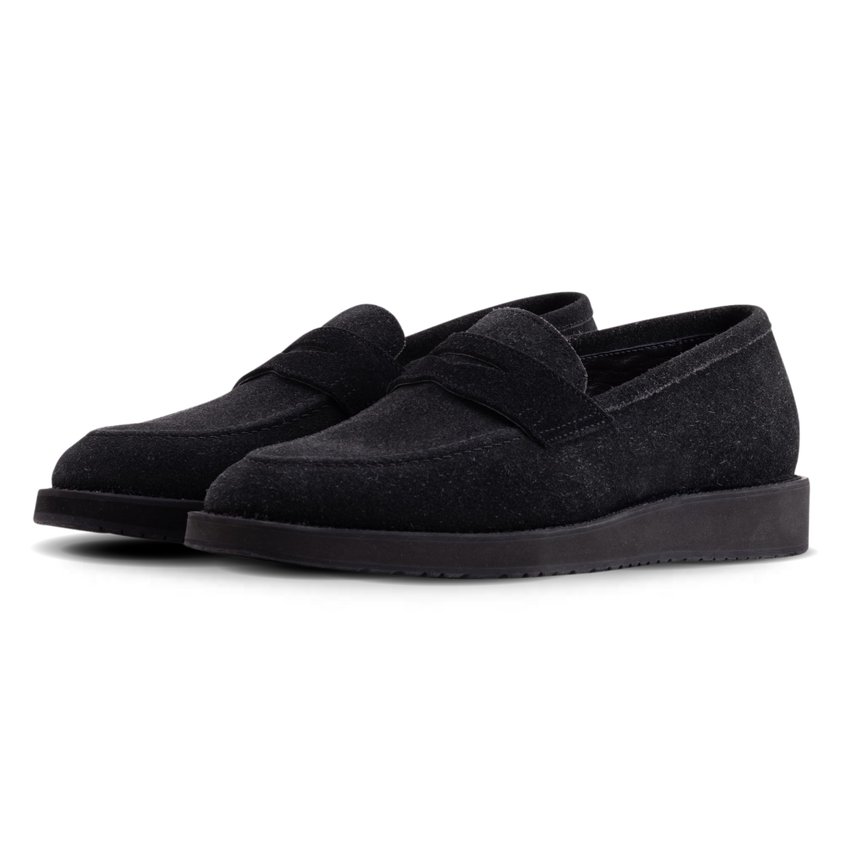 Pair of black loafers on a white background