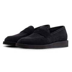 Pair of black loafers on a white background
