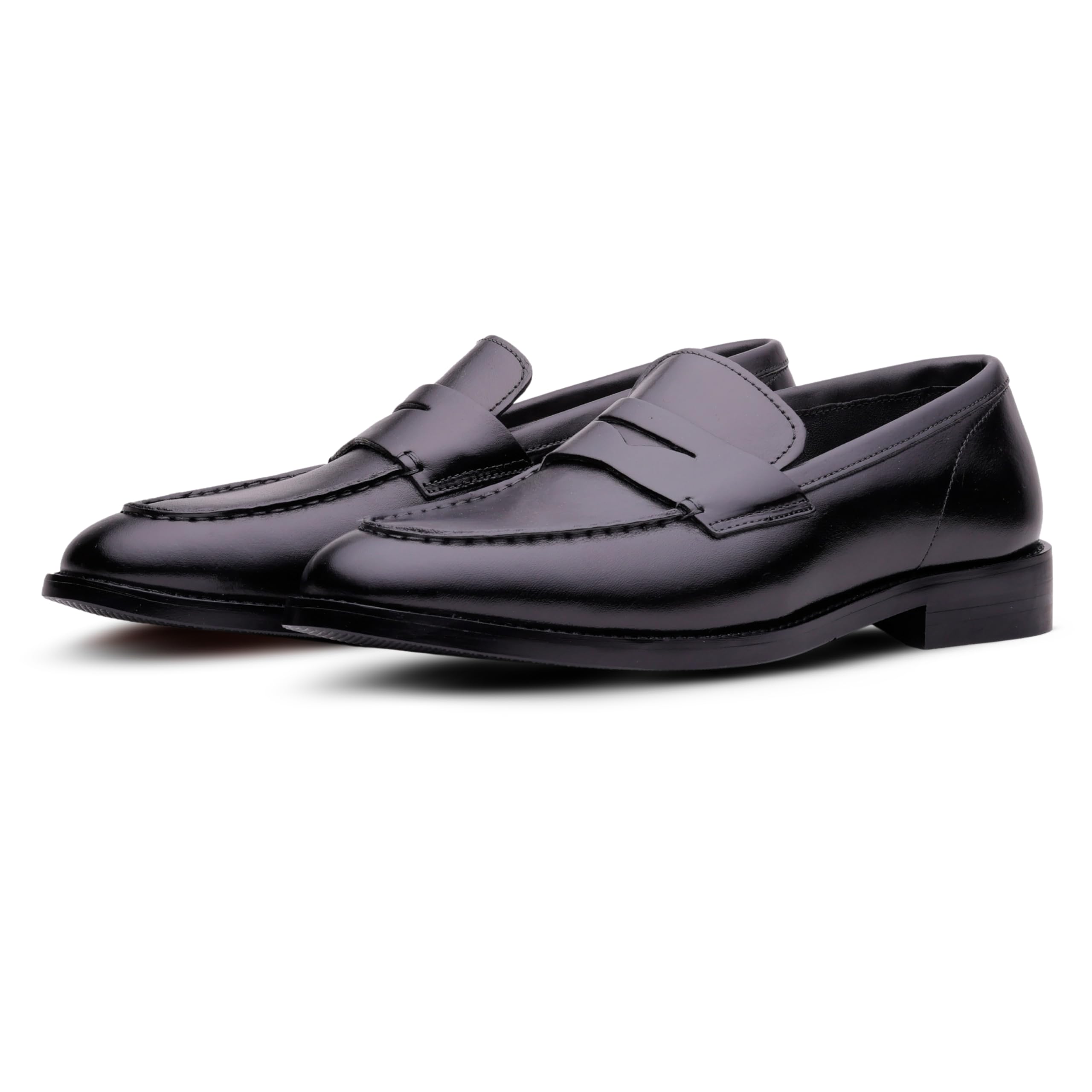 Pair of black loafers on a white background