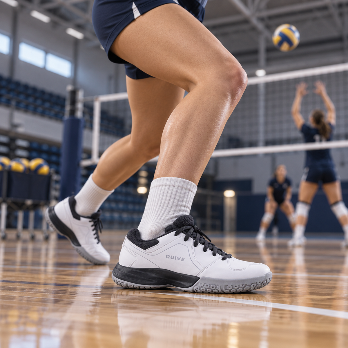 QUIVE Hyper volleyball court shoes worn during an indoor jump-set drill