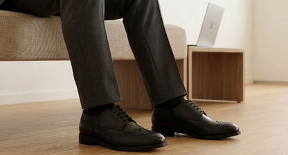 Man wearing QUIVE London Kensington black leather Derby shoes with formal trousers