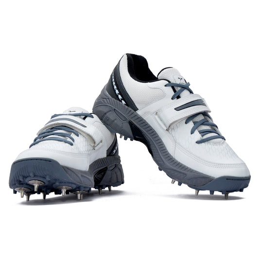 White and gray cricket sports shoes with cleats on a white background