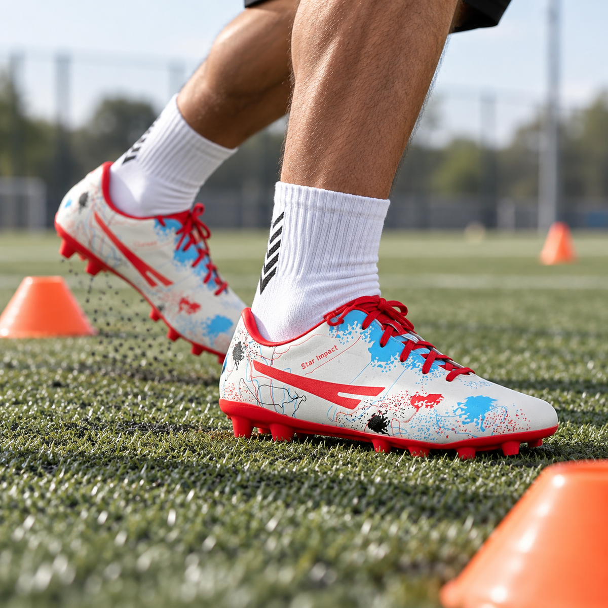 White patterned SEGA Cas-7 football boots worn during a training-cone drill