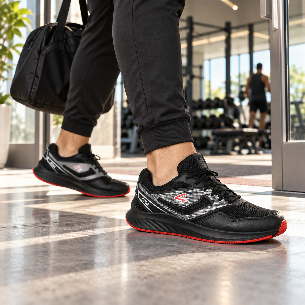 Black and red SEGA Comfort R7 trainers worn arriving at a gym