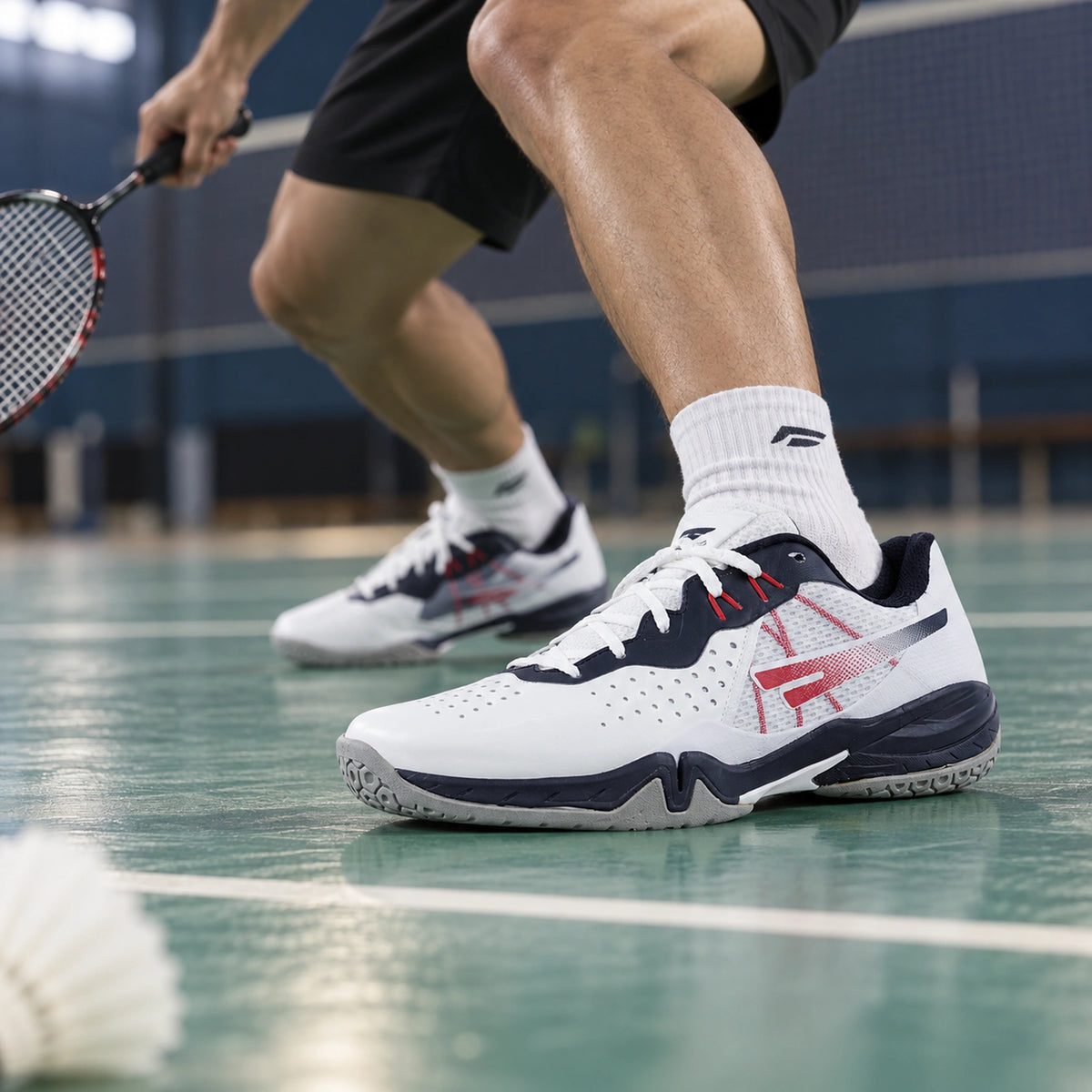 SEGA Freedom 4.0 white, navy and red court shoes worn during a badminton drill